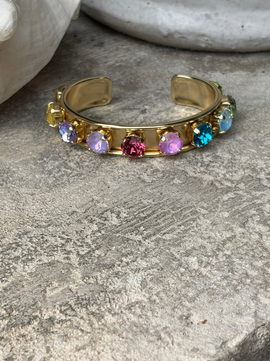 gold cuff with round colored crystals
