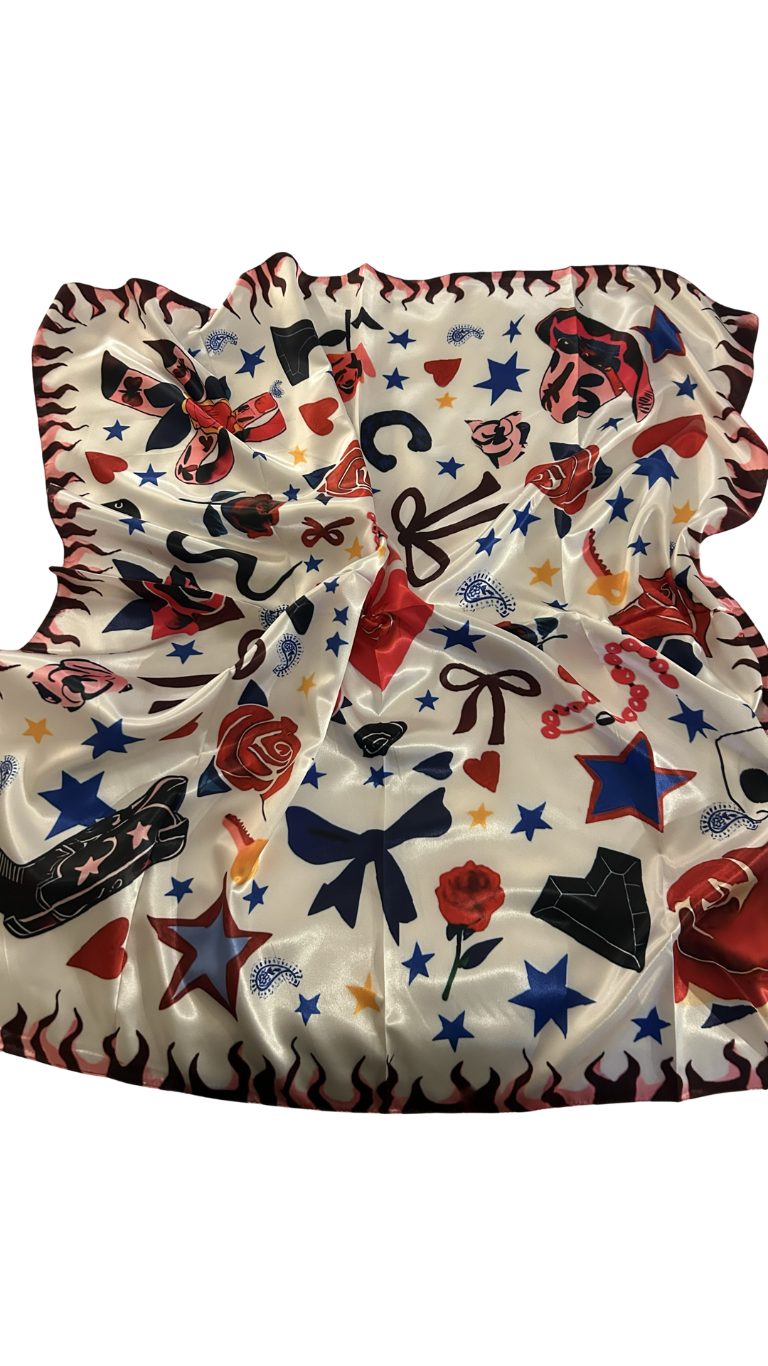 silk like, white scarf with western flare. has stars, black cowboy boots, red roses and bows.