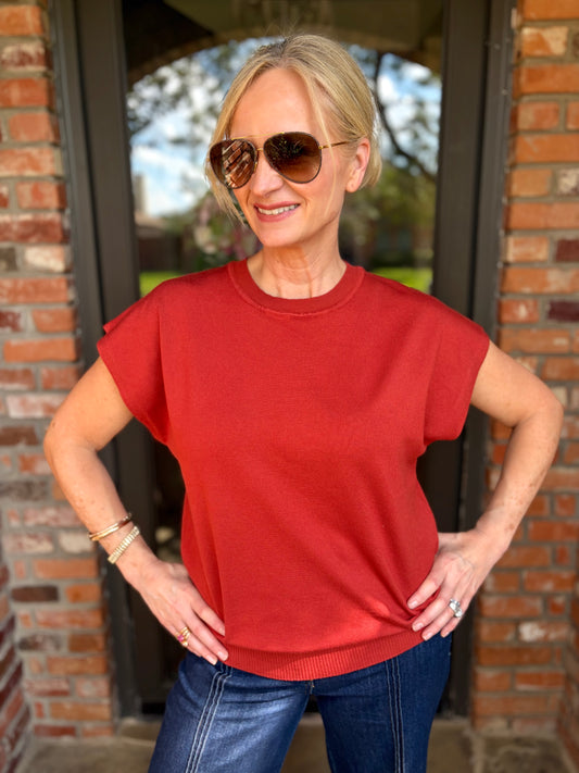 A short sleeve round neck soft knit sweater in rust color 