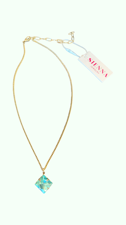 A sienna by Tova 17 inch gold chain necklace with a pendant of aqua crystal stone 