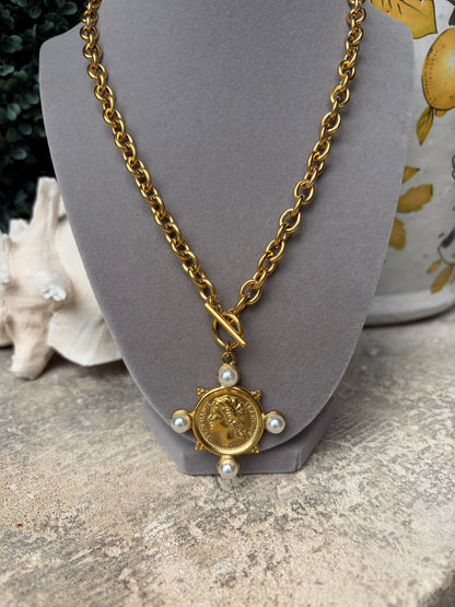 gold link necklace with gold classic coin pendant adorned by pearls