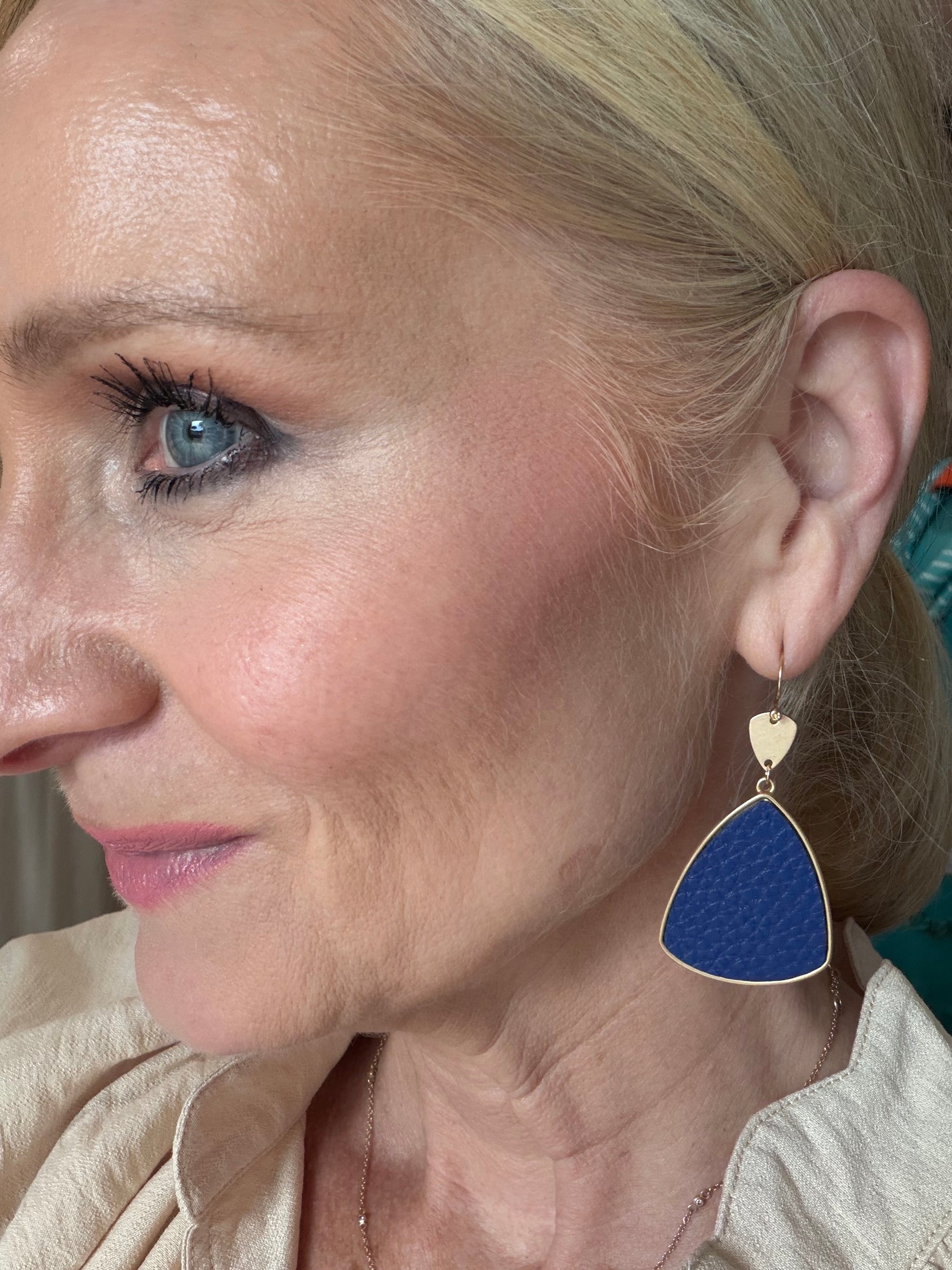 pair of royal blue geo dangle earrings with gold detail