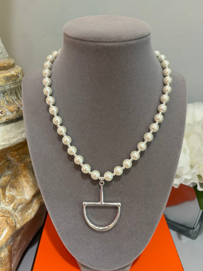 Pearl necklace with a silver  horse bit pendant 