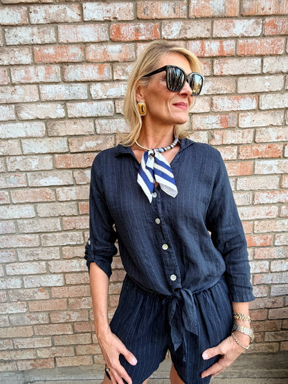 woman wearing a blue italian linen button down, white stripes, tie bouse, with a collar, 3/4 sleeve