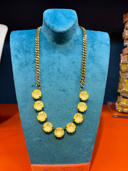 Tova Gold necklace with circular butter lemon colored gemstones on gold link chain that is adjustable