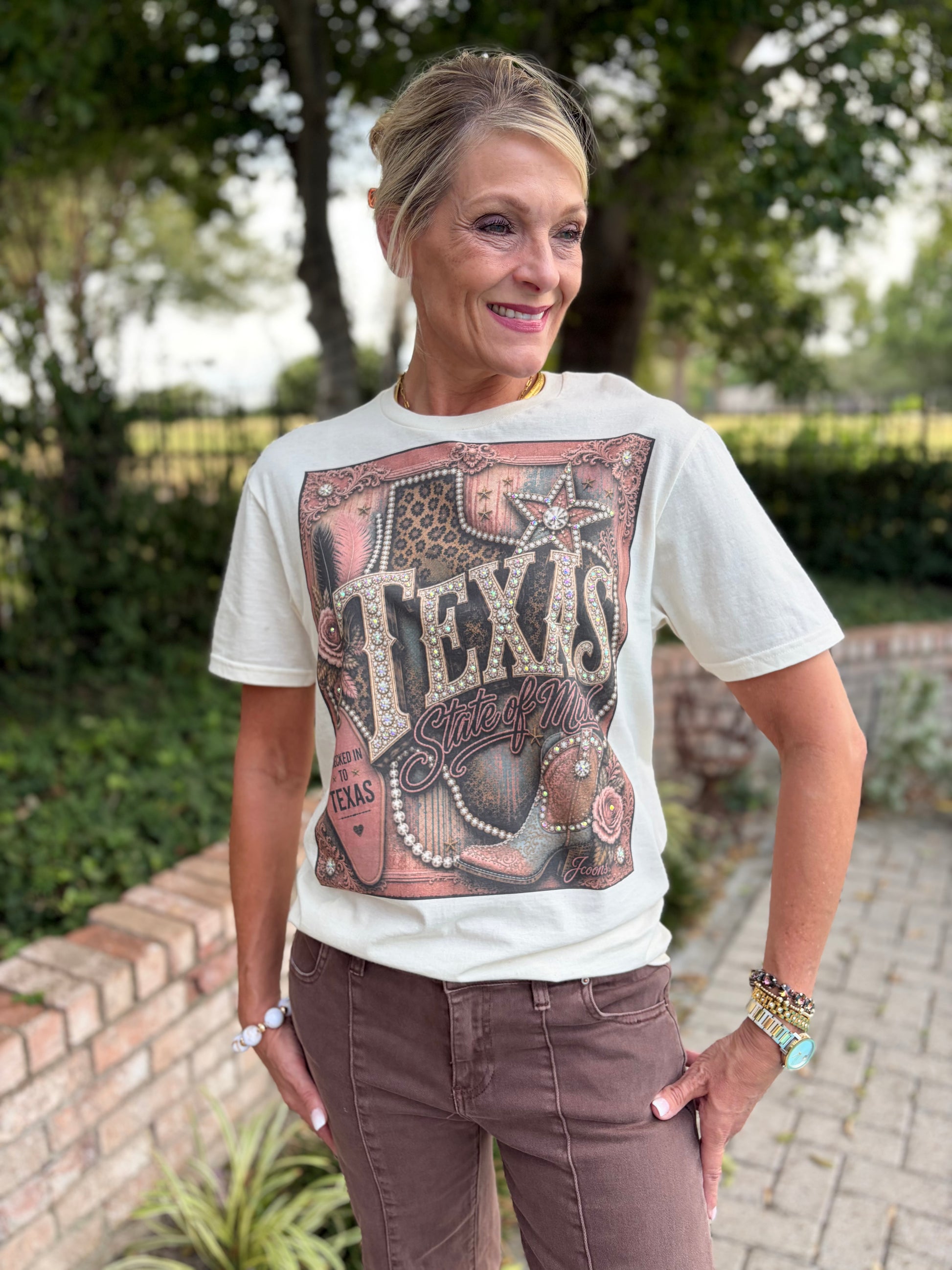 Texas graphic tee that says Texas state of mind with leopard, rose tones and brown on beige short sleeve
