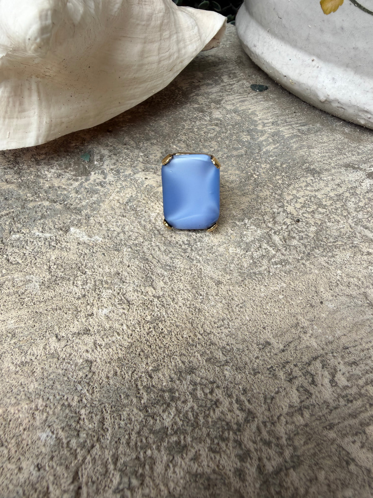 blue stone ring, set in a 22kt gold plated adjustable band
