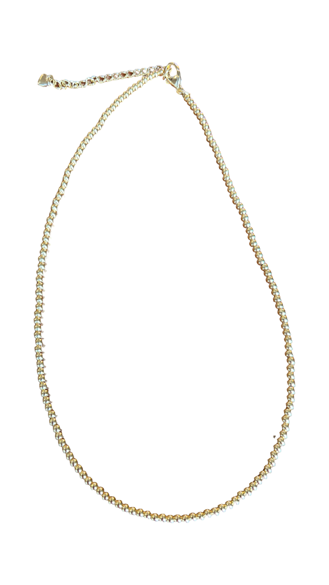 A delicate gold chain necklace with a small lobster clasp and extender chain, displayed on a solid white background.