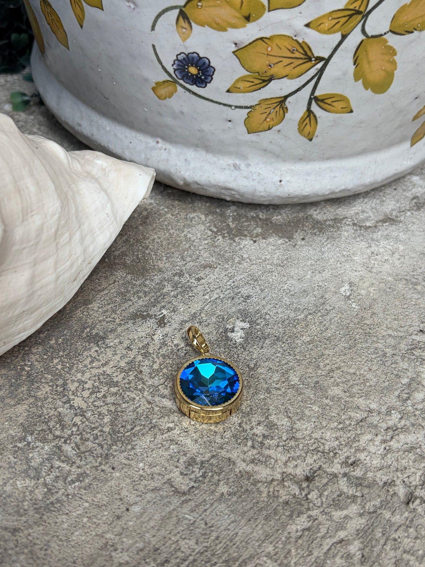 round royal blue crystal charm set in gold bezel
