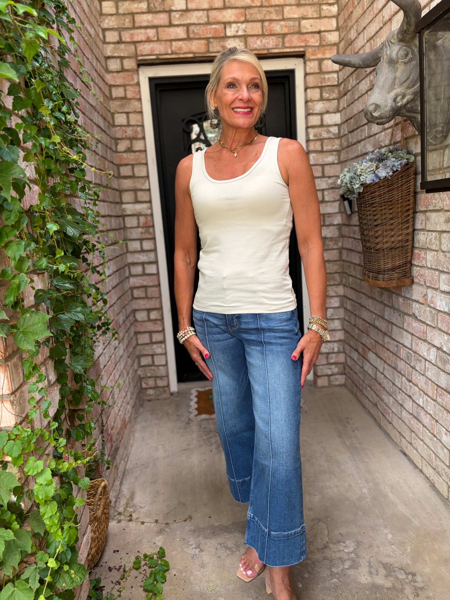 sand beige scoop neck cotton tank top with blue jeans