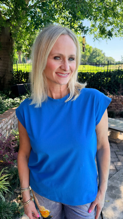 woman wearing a royal blue semi , short sleeve crew neck cotton tee.