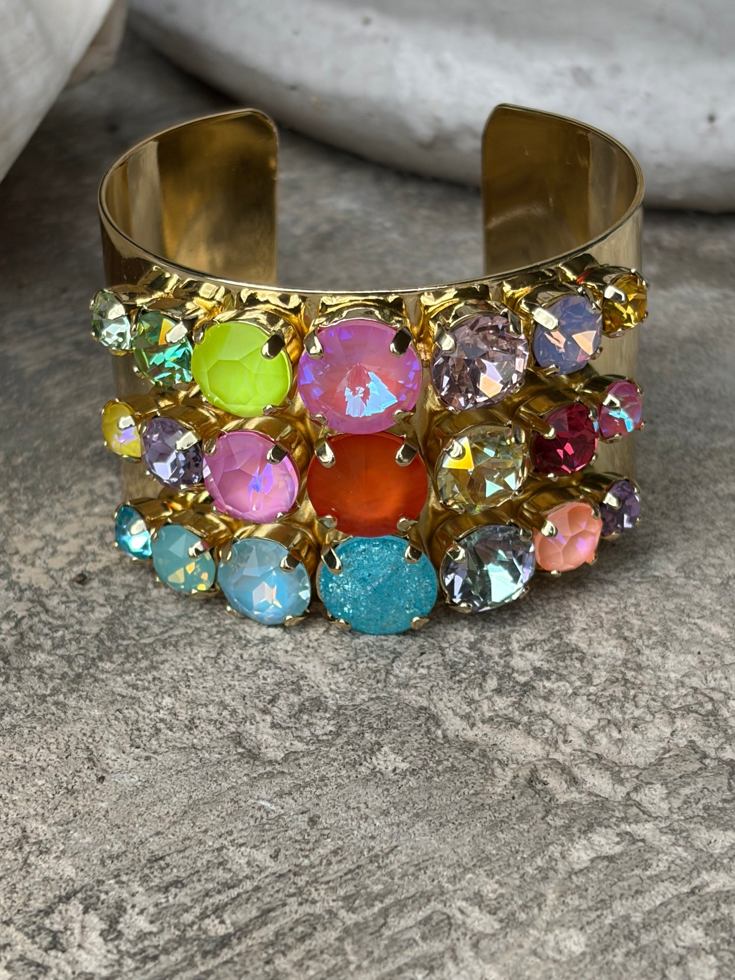 wide gold adjustable wrist cuff with 3 rows of colored crystals