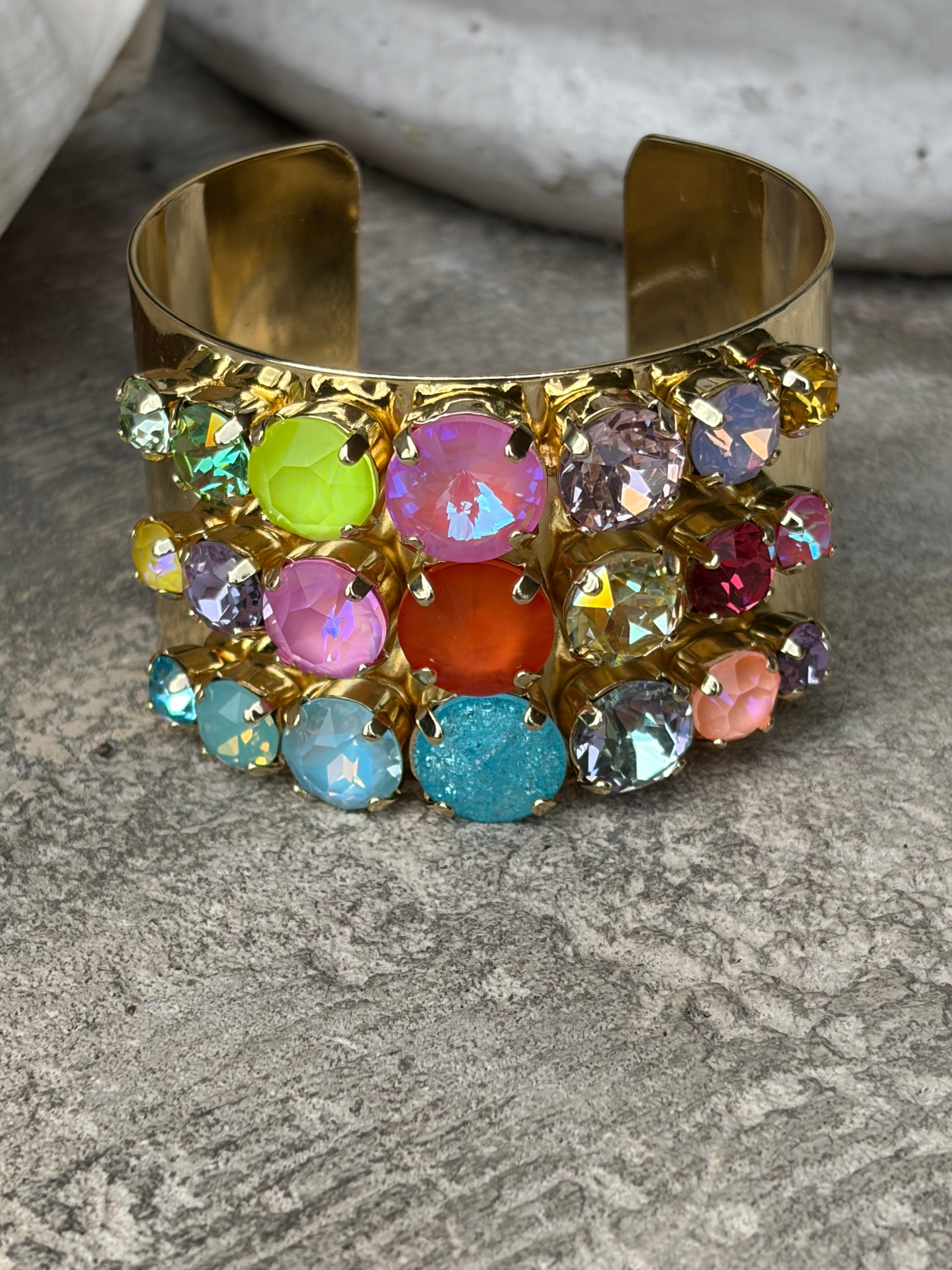 wide gold adjustable wrist cuff with 3 rows of colored crystals