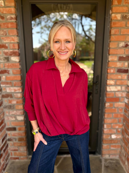  a balloon gathered high low vneck, collared blouse in stunning merlot color with cuffed, long sleeves with mother of pearlized white buttons on cuff. 