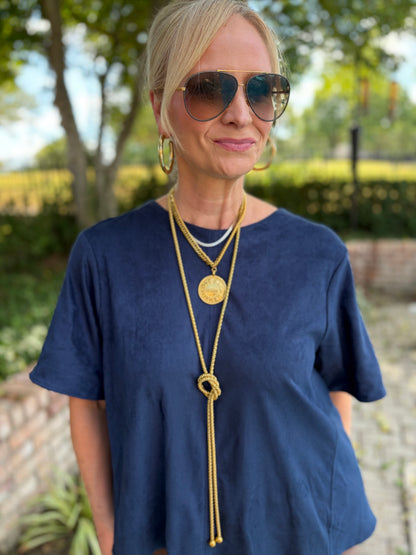 A suede like short sleeved Aline blouse with round neck in Classic navy 
