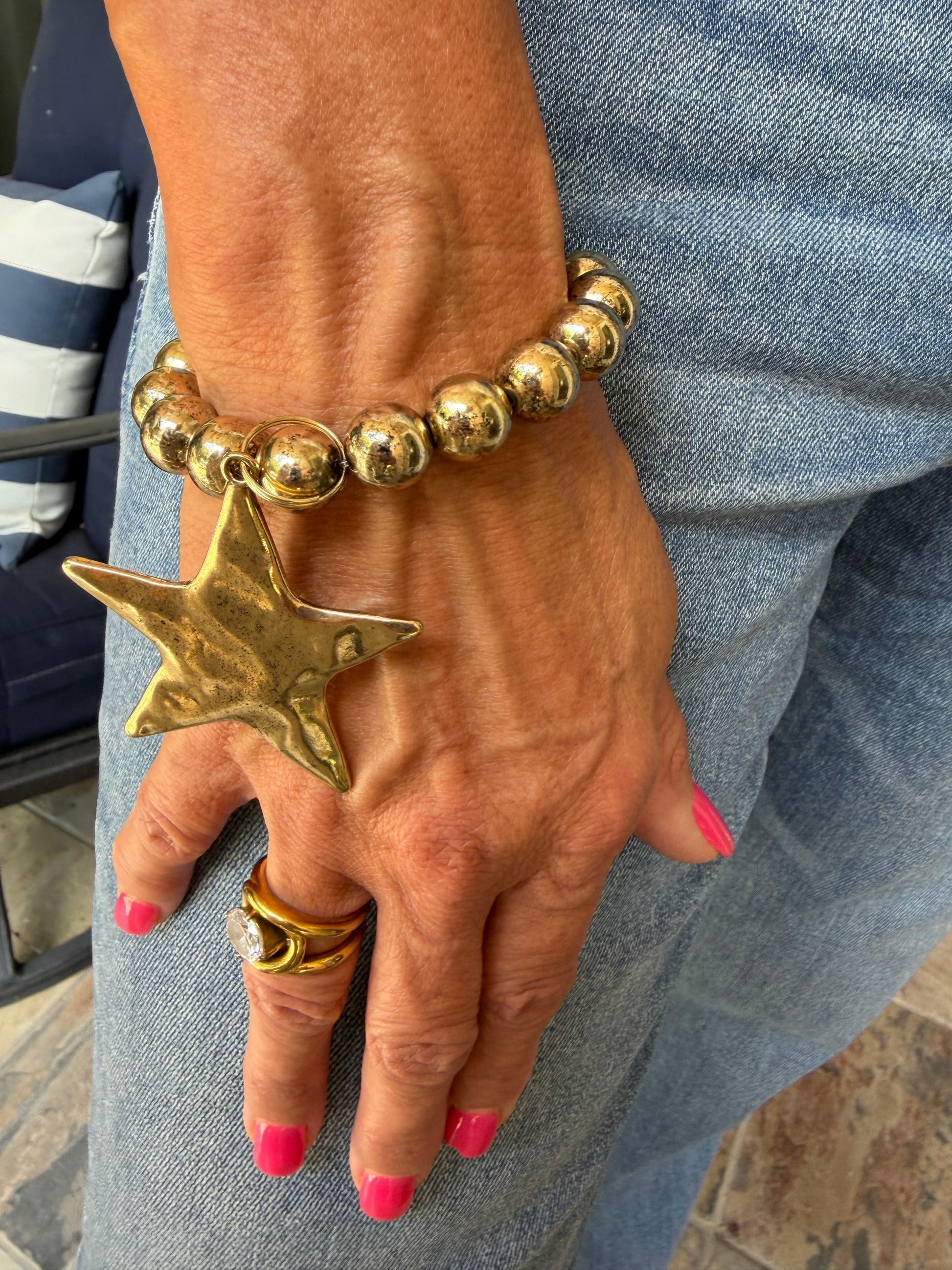 chunky gold bead bracelet with hammered gold star dangle. 