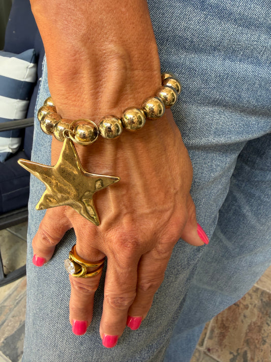 chunky gold bead bracelet with hammered gold star dangle. 