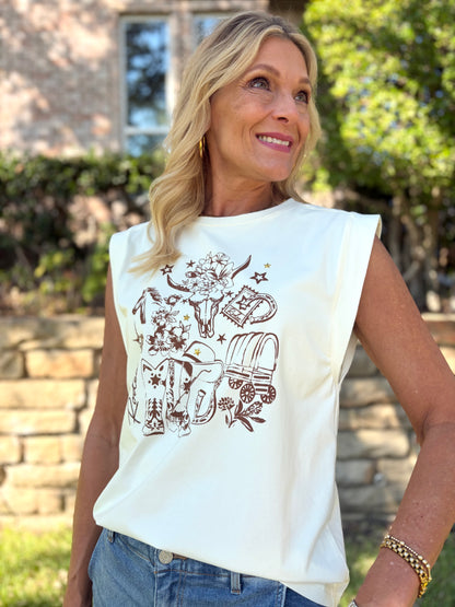 Cream sleeveless round neck tee with brown western design of hat, heart necklace, stars, the word rodeo and cactus 