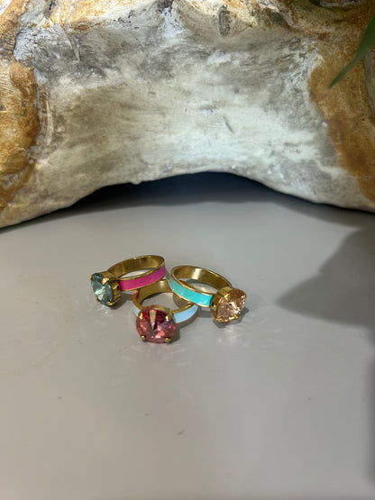 Tova gold and colored enamel rings with single solitare gemstones. 