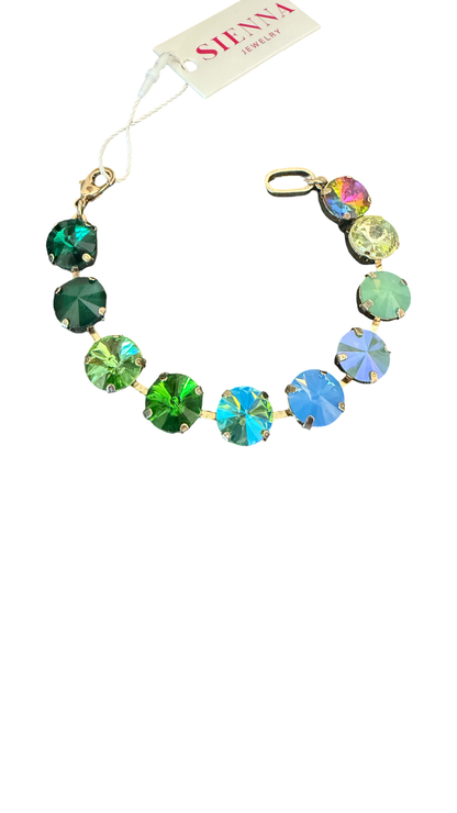 A multi-color round crystal charm bracelet by Sienna Jewelry, featuring green, blue, and iridescent faceted stones set in gold-toned metal