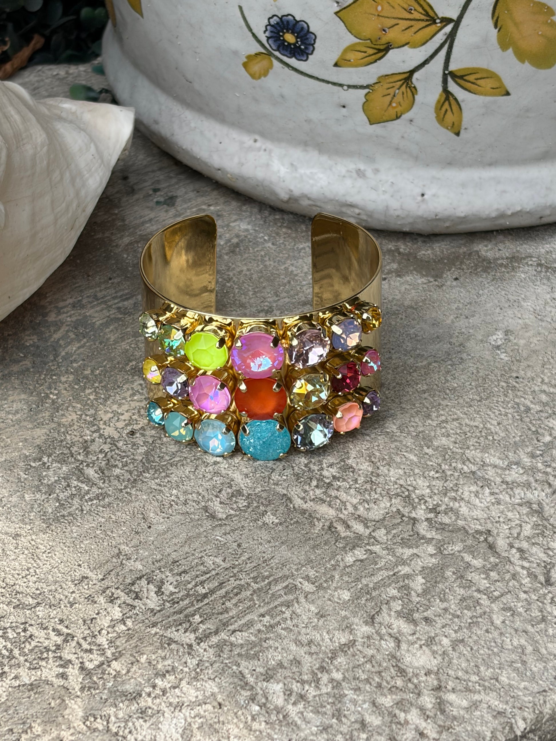 wide gold adjustable wrist cuff with 3 rows of colored crystals