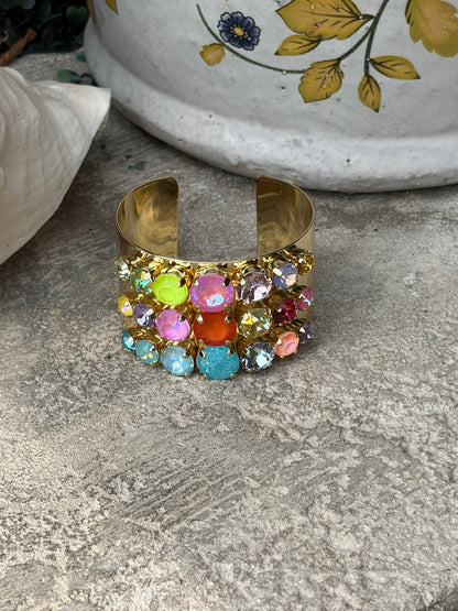 wide gold adjustable wrist cuff with 3 rows of colored crystals