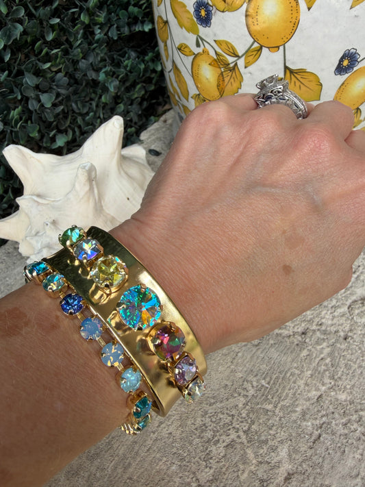 gold bangle adjustable cuff with multiple jewel crystals in a row that are round