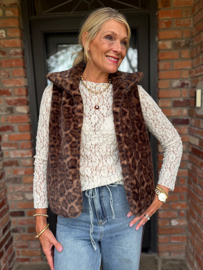 a soft, brown and black tone faux fur open leopard print, sleeveless vest