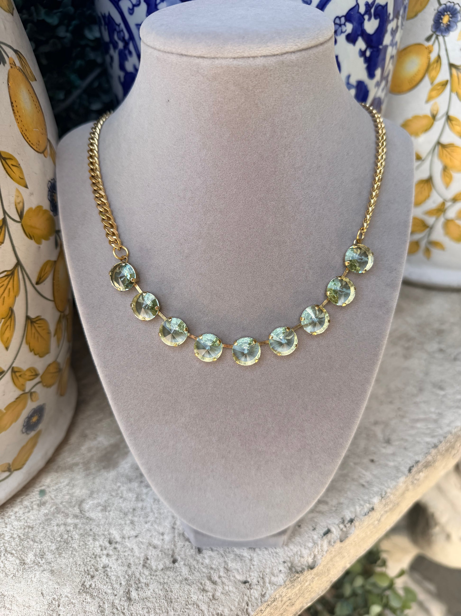 tova mini sophia necklace with small gold chain and adorned with aqua crystals
