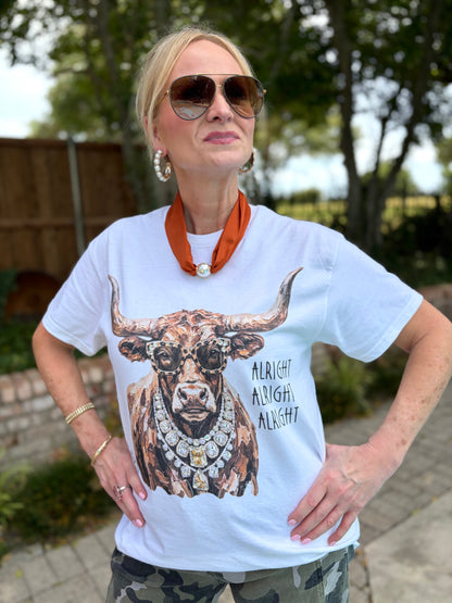 a white, short sleeve tee with a long horn graphic wearing leopard glasses and bling necklace.  Also has wording