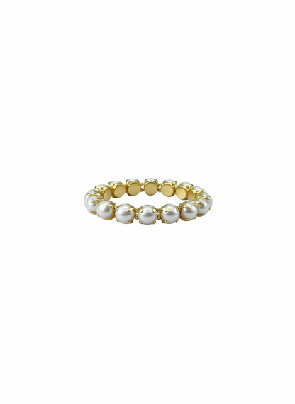 A delicate gold plated water resistant stretch bracelet  featuring a row of small, lustrous white  pearls, shown against a solid white background.