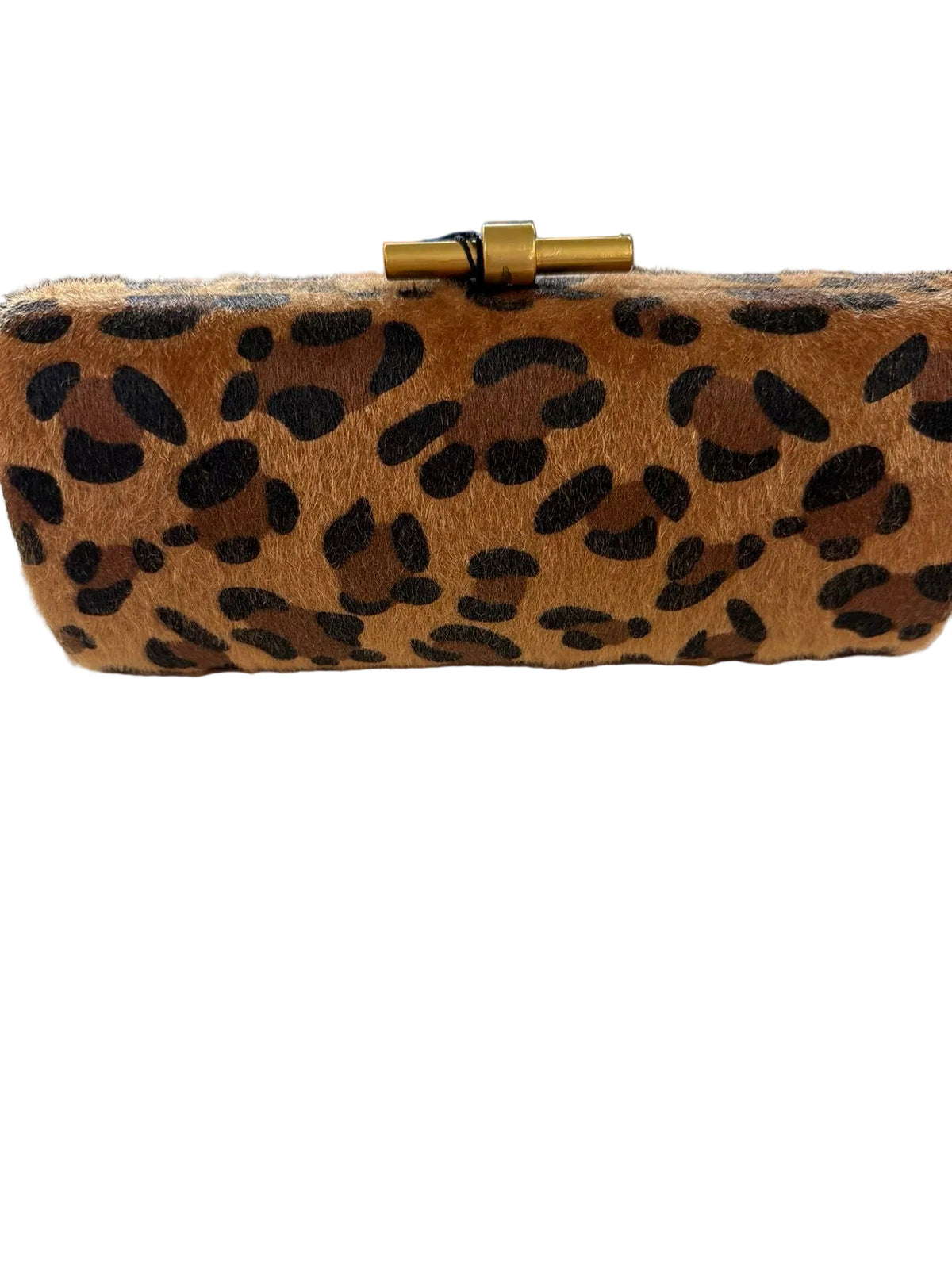 A leopard print faux fur clutch bag with a gold clasp, resting on a white shelf in a retail store.