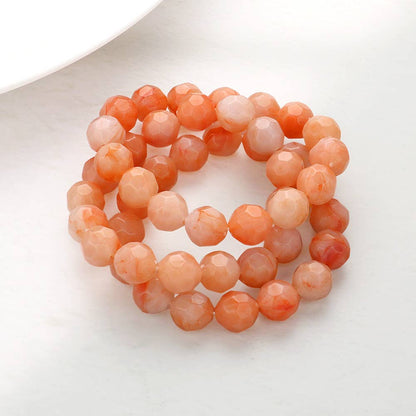 set of 3 faceted bead bracelets in peach and cream tones