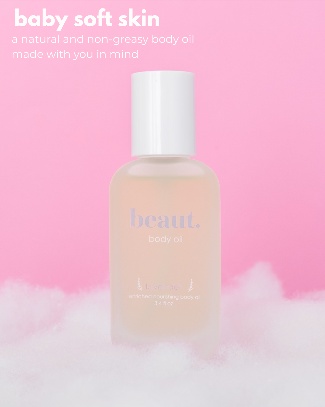 A frosted bottle of beaut. body oil with a white cap, set against a soft pink background with white fluffy clouds at the bottom and promotional text in the upper left.