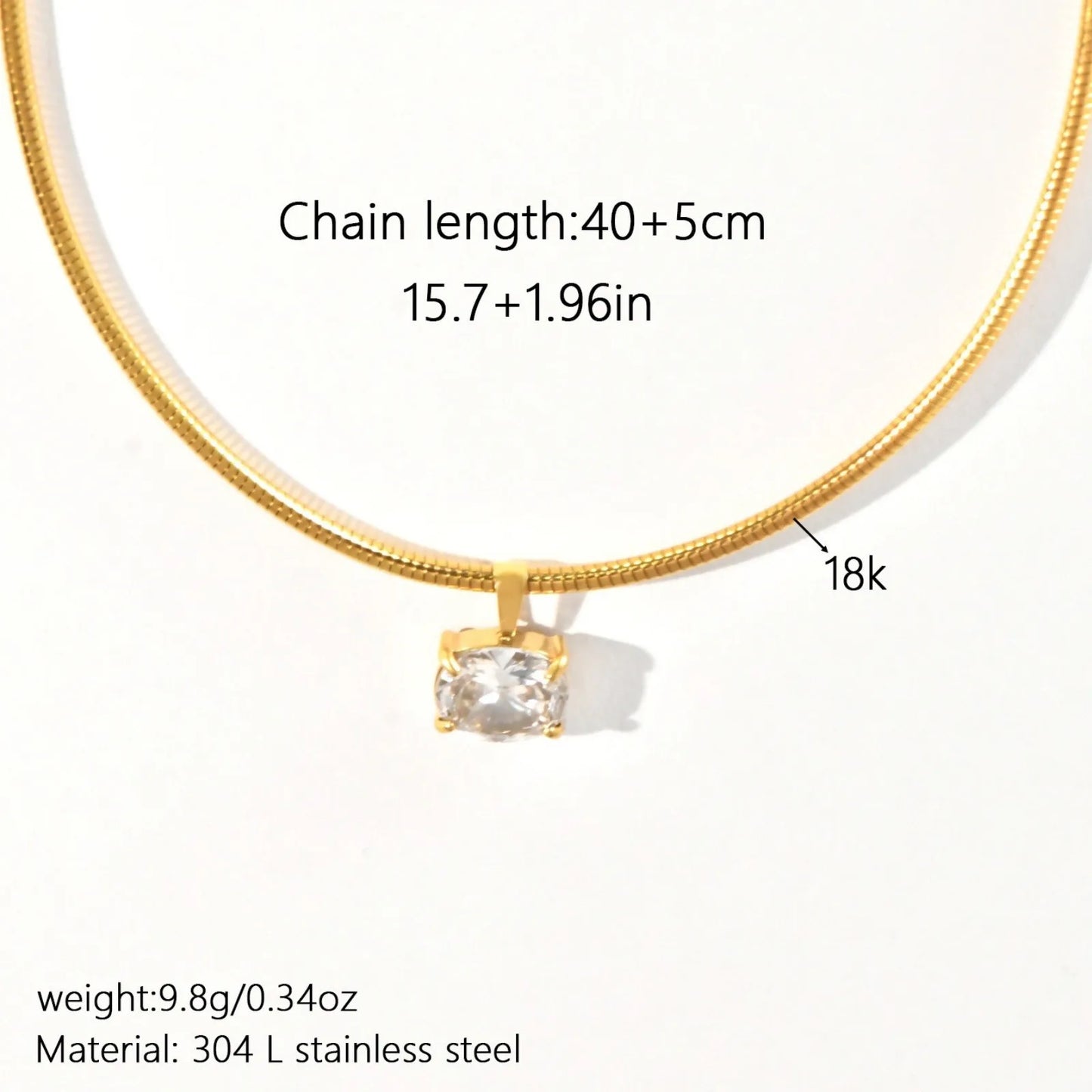 Gold necklace with a diamond pendant on a white background, showing chain length, weight, and material details.