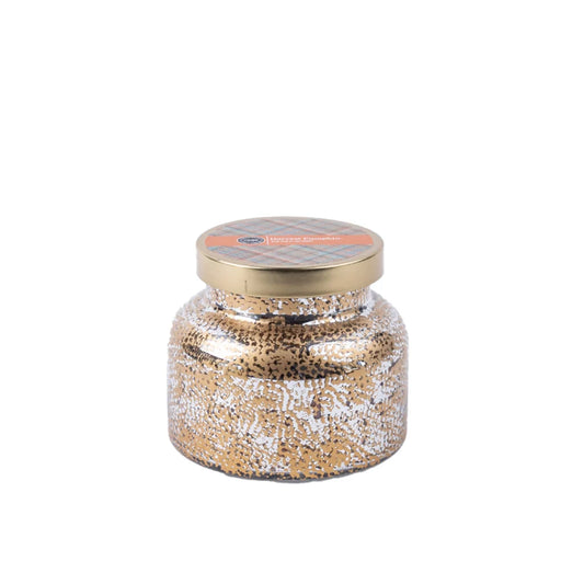 A decorative mercury glass jar candle with a textured gold and white speckled body, a gold metal lid in pumpkin spice scent