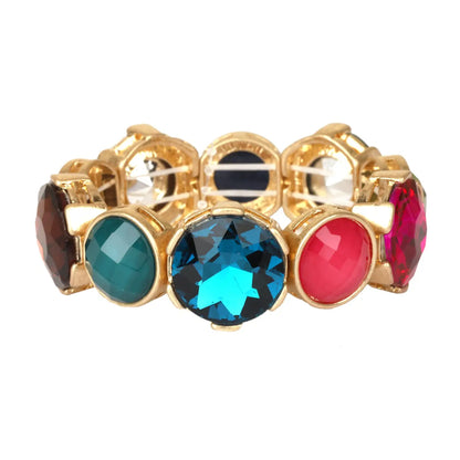 A gold-plated stretch band bracelet featuring multiple round faceted gemstones in dark brown, teal, light blue, red, and dark pink, displayed on a clean white background.