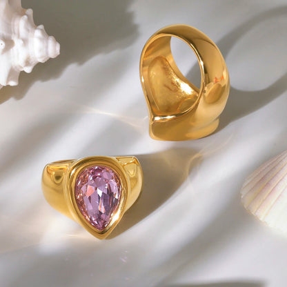 sized gold ring with pink pear-shaped faceted stone. Stainless steel