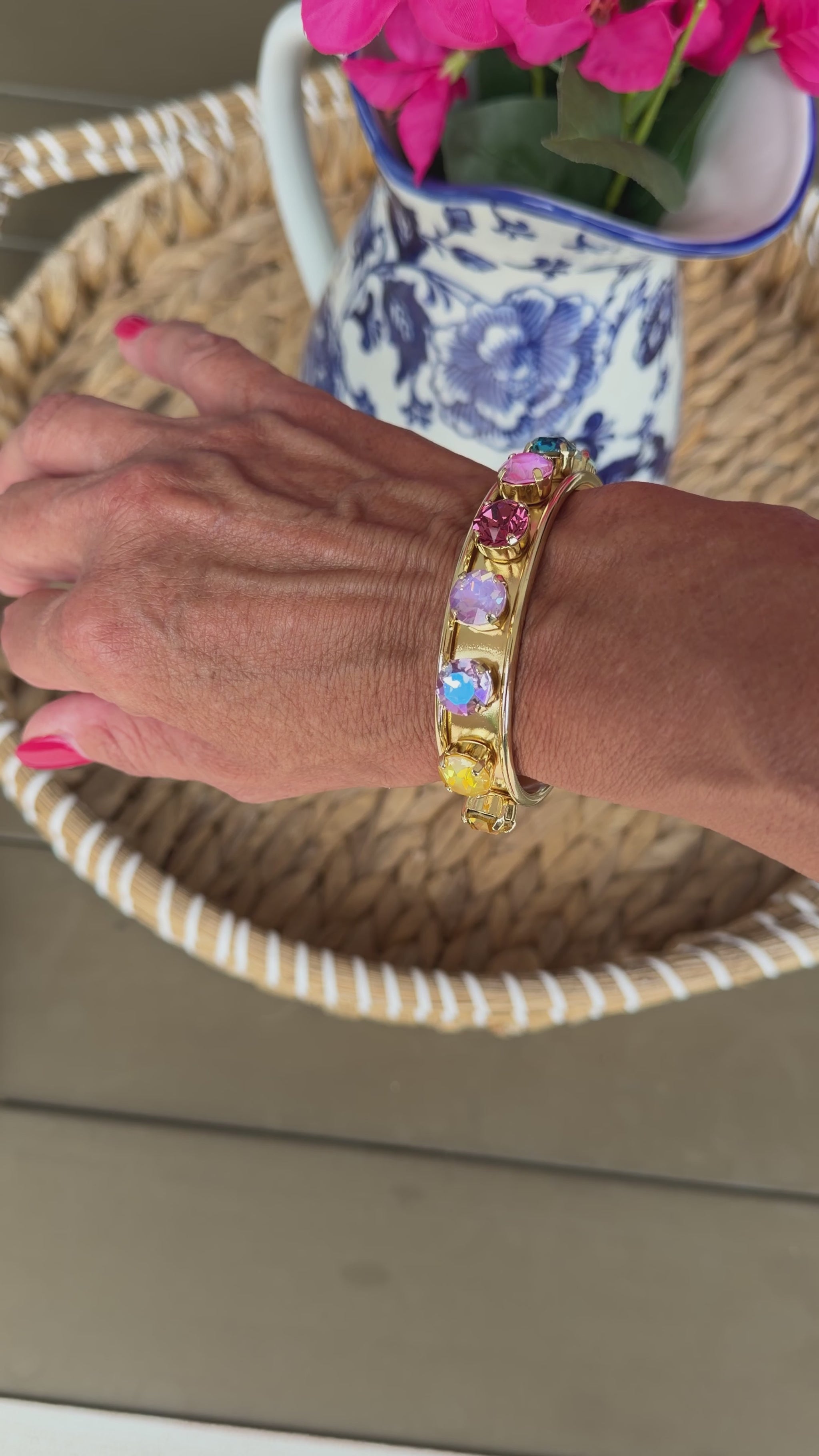 video of gold cuff with colored crystals
