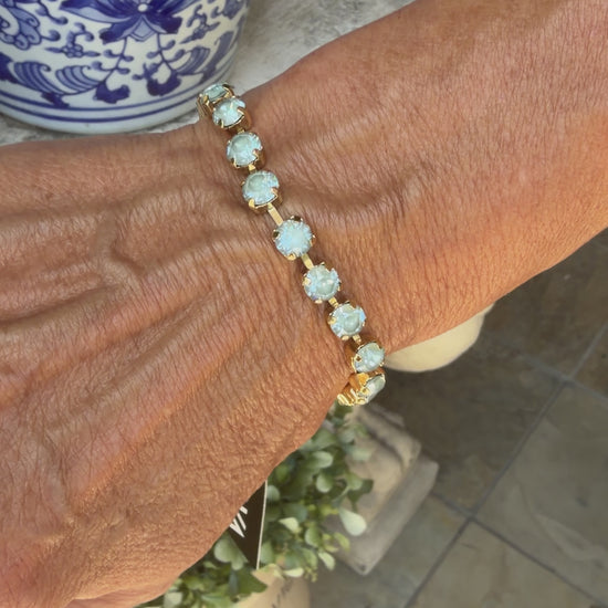 video of women in light blue crystal tova bracelet