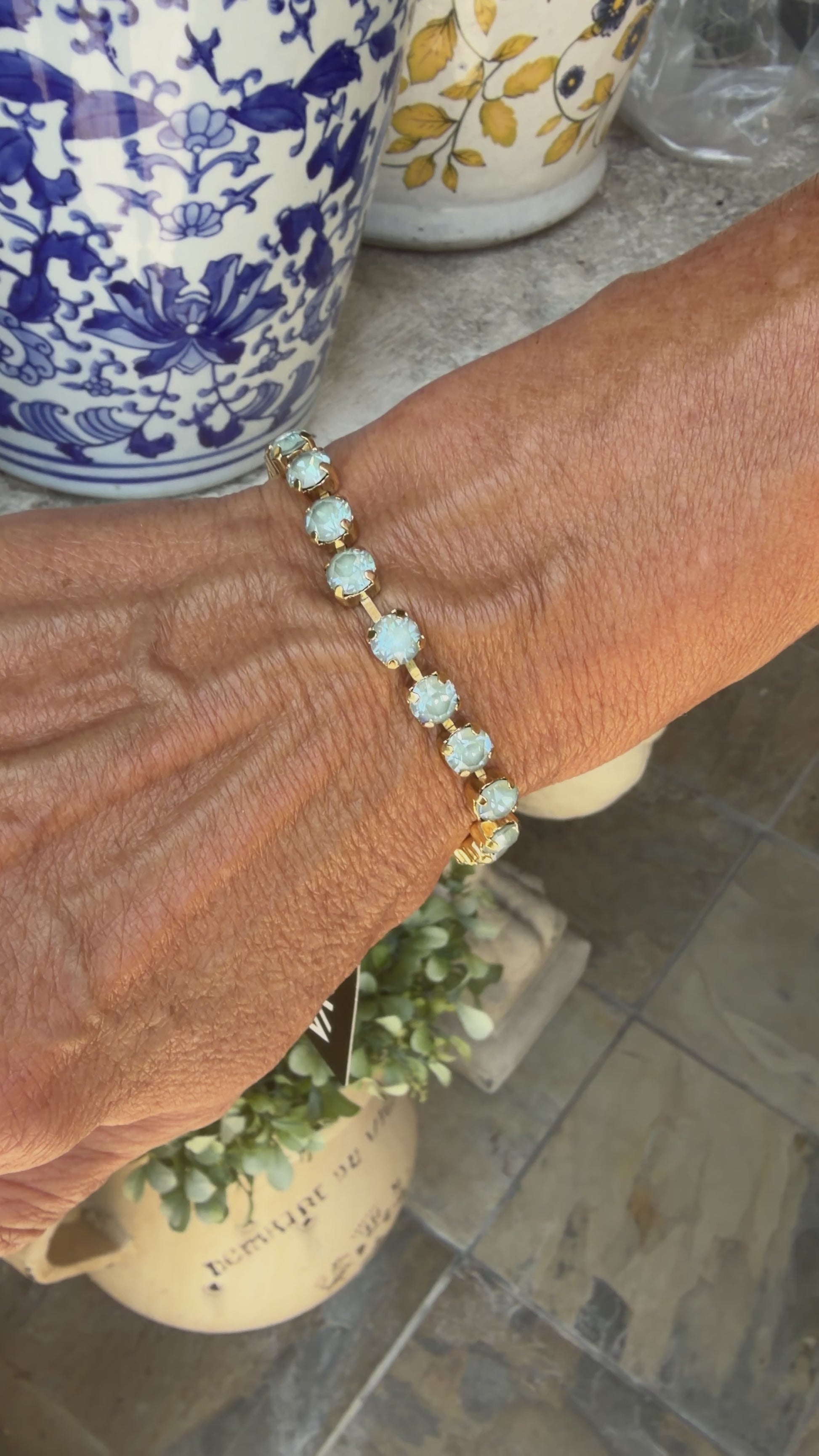 video of women in light blue crystal tova bracelet