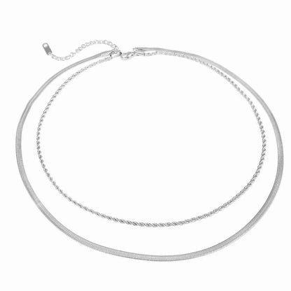 A double-layered silver chain necklace featuring a textured twisted rope chain and a smooth snake chain, displayed on a clean white background.