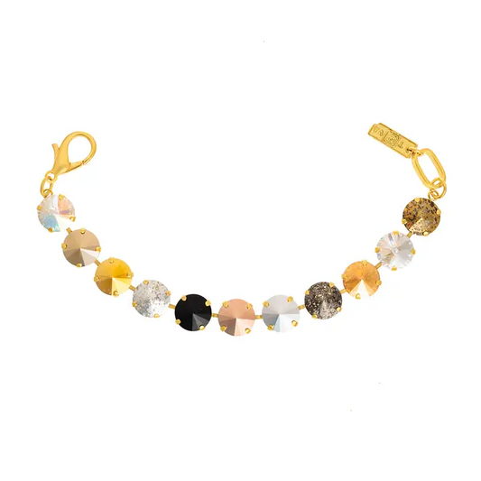 A tova gold-plated bracelet featuring a series of round, faceted gemstones in various colors including gold, silver, black, bronze, and glittery brown, displayed on a clean white background.