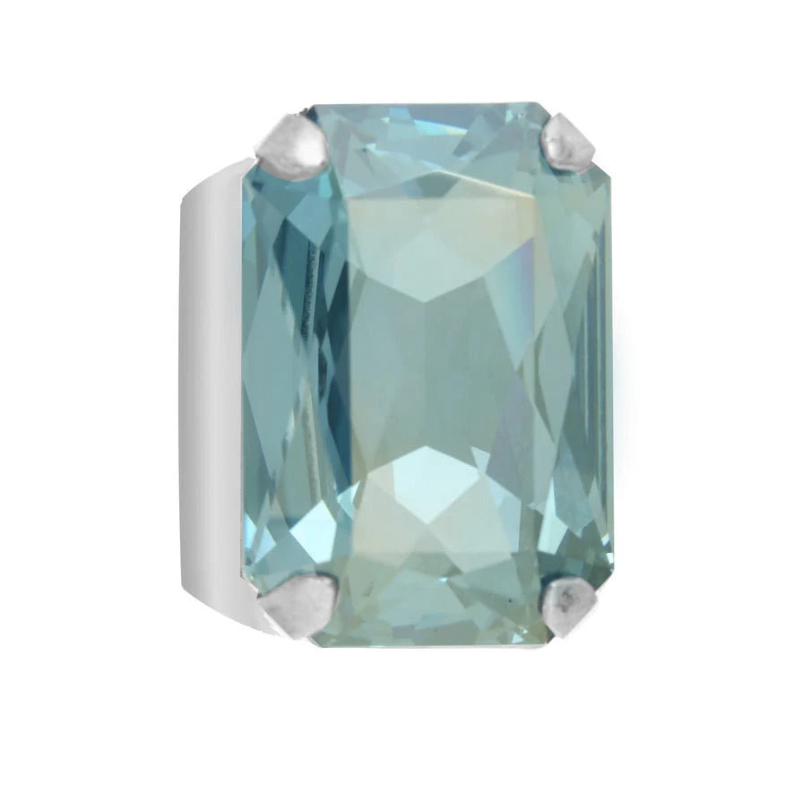 A Tova mini soleil ring. rectangular emerald-cut light aqua blue Swarovski crystal set in silver four-prong setting and it is adjustable
