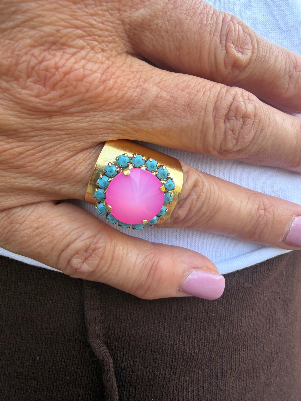 Tova bright pink crystal stone round shaped adjustable ring with turquoise stone all around 